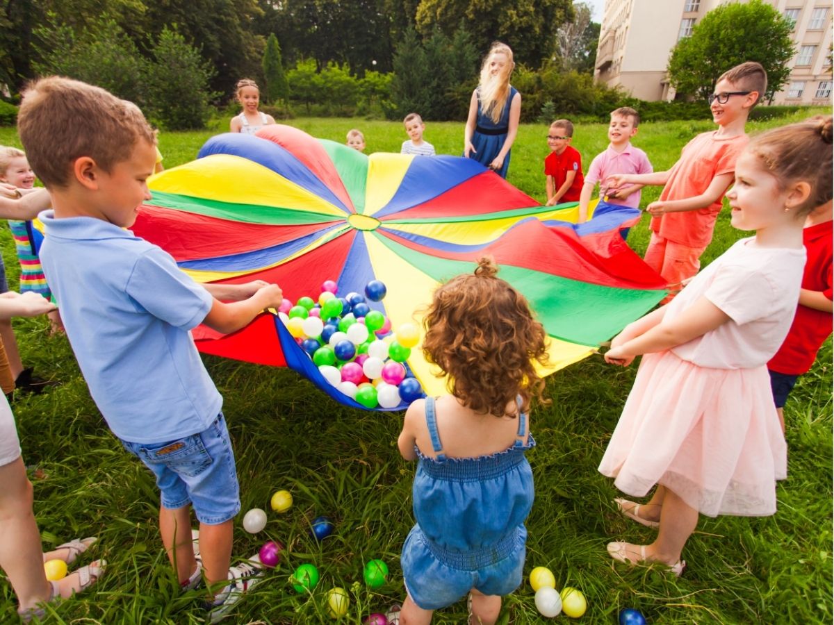 kids playing with parachute